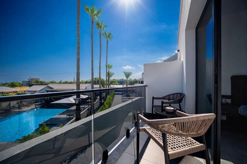 Private balcony seating with pool view